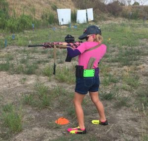 youth shooting an AR 15 sporting rifle