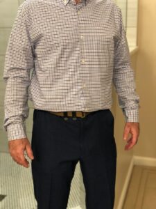 concealed carry wearing a button-up shirt and tie