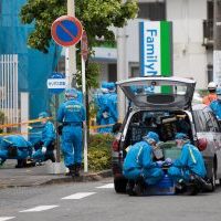 Is this tragic stabbing that occured in Japan proof that the United States needs more gun control? photo courtesy of: Behrouz Mehri / AFP - Getty Images
