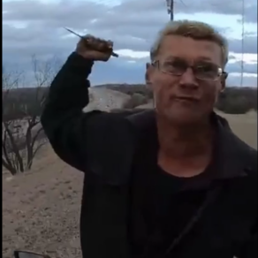 armed man stabbing motion