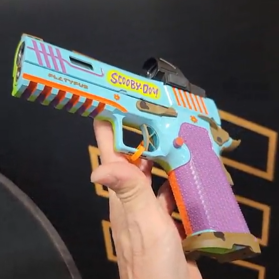 Scooby Doo Gun custom 1911 pistol with Mystery Machine colors and cartoon graphics on slide