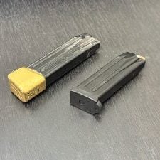 A training mag on the left and a pristine carry mag on the right.