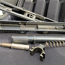 Field stipping the gun shows the uncaptured recoil spring, and the AF Speedlock