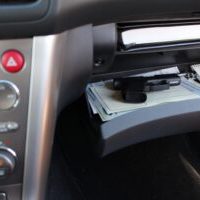 gun in glovebox car compartment