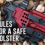 HK VP9 pistol in a red KSG Armory Lexington Kydex holster laying on rocks, illustrating safe concealed carry holster setup for the Holster Safety Checklist