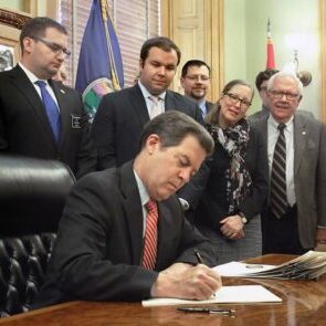 Gov. Sam Brownback signed legislation Thursday adding Kansas to the short list of states allowing unlicensed possession of concealed firearms and eliminating a weapons training mandate for people to carry hidden guns. THAD ALLTON THE ASSOCIATED PRESS